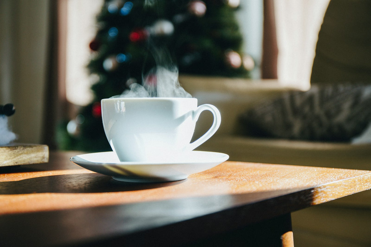 Coffee cup on a cozy Christmas table