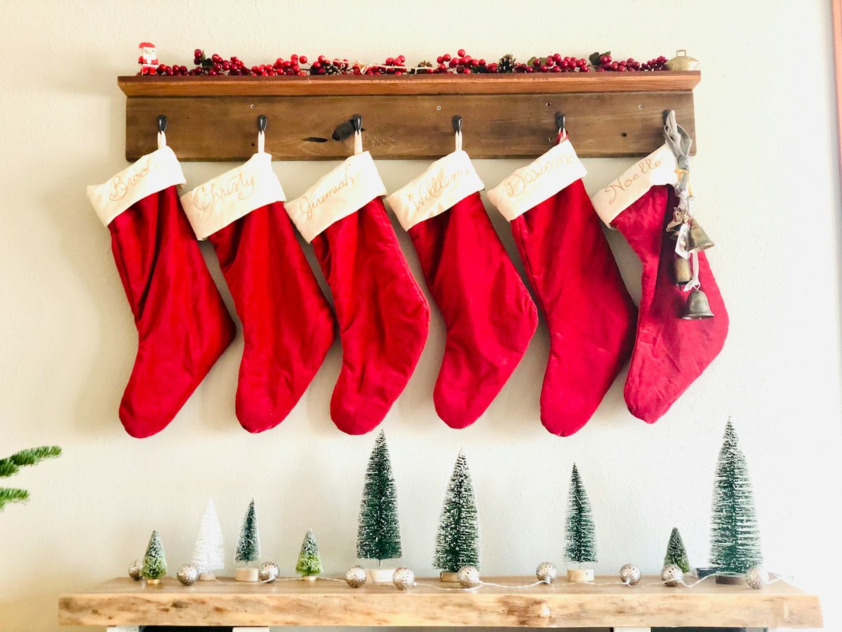 Christmas stockings on a wooden shelf