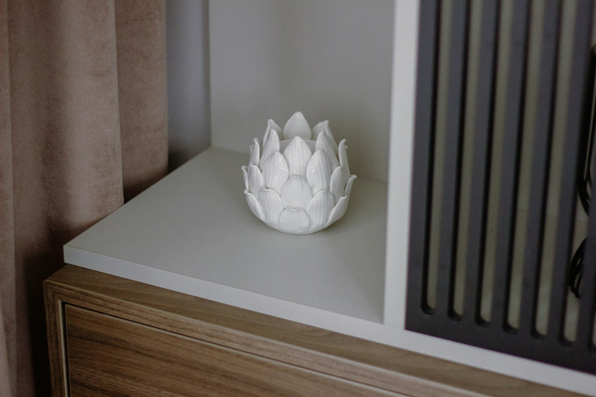 Minimal styled home decor on a wooden dresser